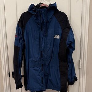 The North Face summit series blue + black jacket size large in great condition